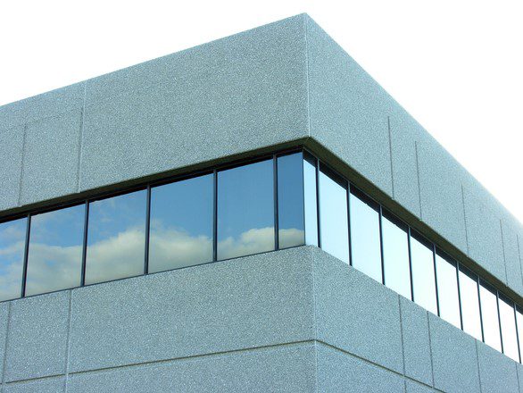 A modern office building with a flat low-slope roof.